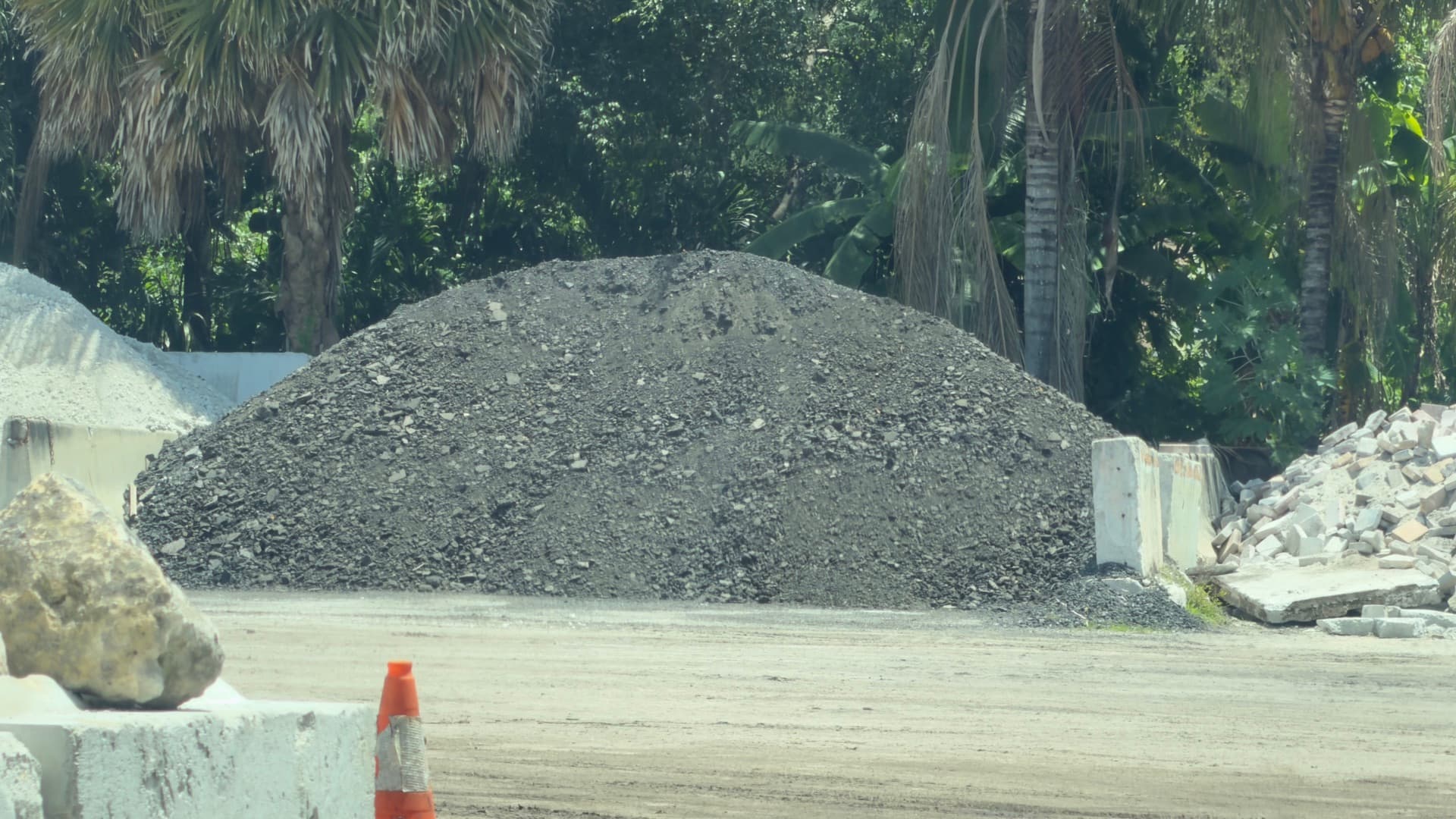Trailer dumping crushed concrete millings on a driveway